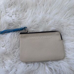 Bimba Y Lola Cream Wristlet with Blue Strap